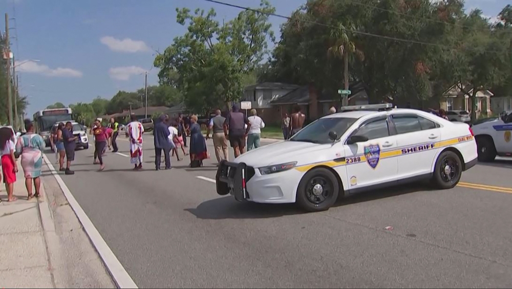 This video grab shows police cars on the site of a shooting in Jacksonville, Florida, August 26, 2023. (Photo by AFP)
