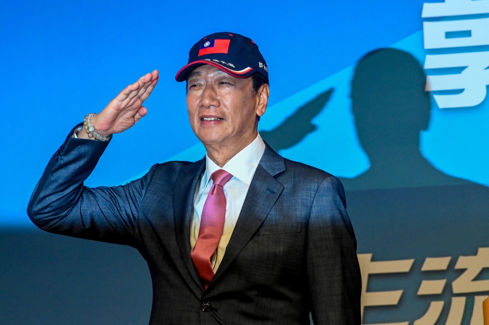 Former Foxconn Founder Terry Gou salutes during a press conference in Taipei on August 28, 2023. Gou announced that he will run for president of Taiwan as an independent candidate. (Photo by Sam Yeh / AFP)