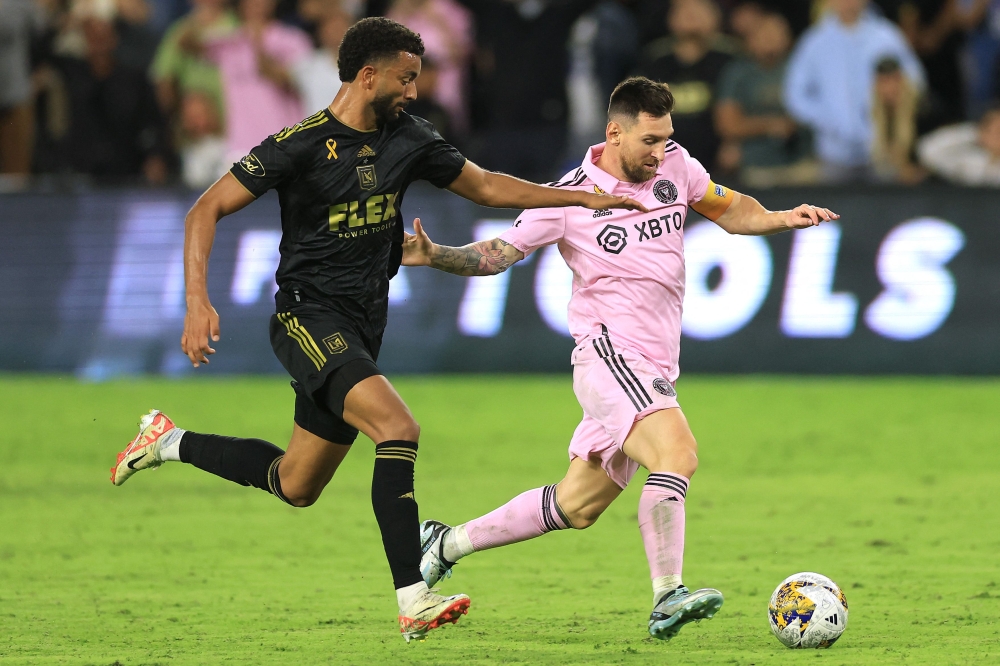 Lionel Messi #10 of Inter Miami CF controls the ball against Timothy Tillman #11 of Los Angeles FC during a match at BMO Stadium on September 03, 2023 in Los Angeles, California. Sean M. Haffey/Getty Images/AFP 