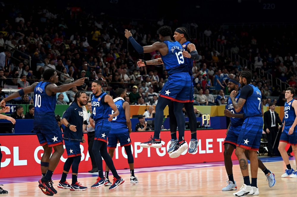 US's players react during the FIBA basketball World Cup quarter-final match between US and Italy in Manila on September 5, 2023. (Photo by Jam Sta Rosa / AFP)

