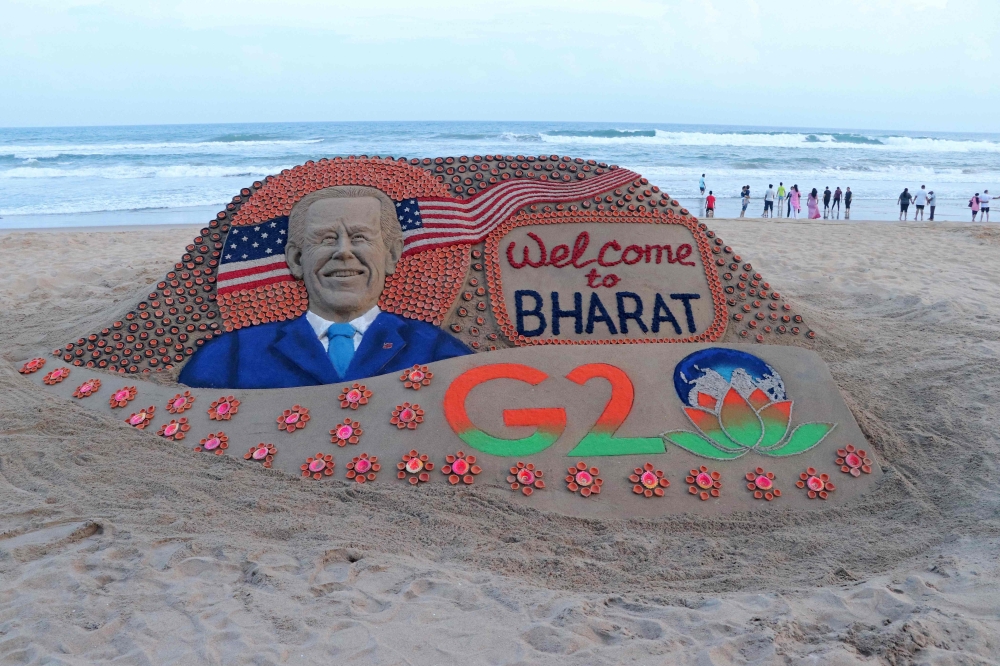 In this picture taken on September 6, 2023, a sand sculpture created by Indian sand artist Sudarsan Pattnaik representing US President Joe Biden's visit to India for the two-day G20 summit is pictured at Puri beach in India's Odisha state. (Photo by AFP)