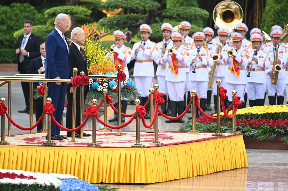 US President Joe Biden attends a welcoming ceremony hosted by Vietnam's Communist Party General Secretary Nguyen Phu Trong (2L) at the Presidential Palace of Vietnam in Hanoi on September 10, 2023. (Photo by Saul Loeb / AFP)