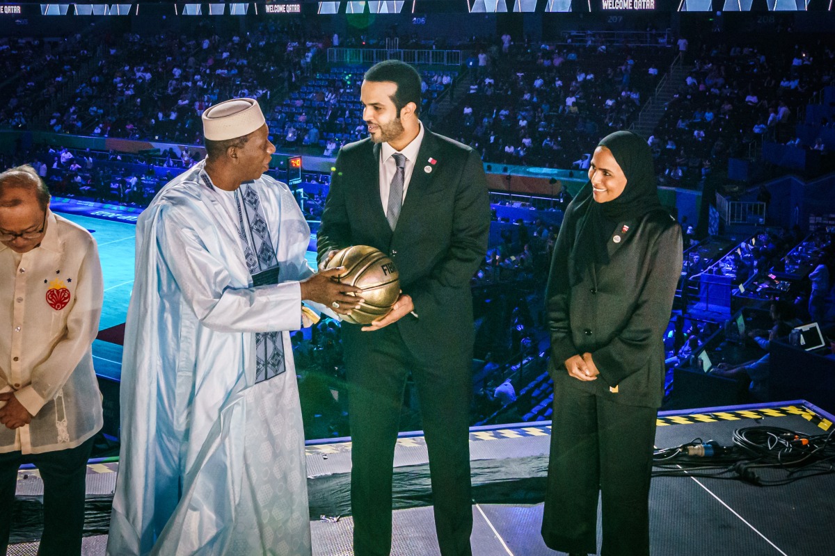 Haman Niang, President of the International Basketball Federation handed the ball for the 2027 FIBA ​​World Cup to Mohamed Al Maghaiseeb, President of the Qatar Basketball Federation, and Sheikha Asma Al Thani, Director of Marketing and Communication Department of the Qatar Olympic Committee during a ceremony on the sidelines of the 2023 FIBA ​​World Cup closing ceremony in Manila, Philippines, on  September 10, 2023.