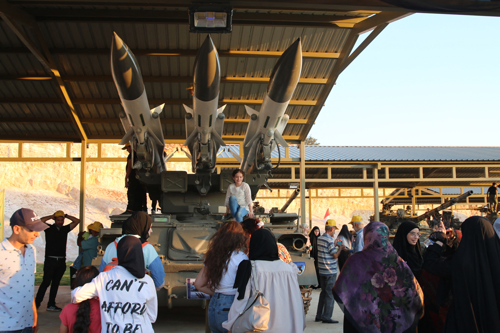 People visit a new Hezbollah museum displaying military equipment which the group says it captured during clashes with Israeli forces and the Syrian conflict, during its inauguration in the Lebanese city of Baalbeck, on August 26, 2023. (Photo by AFP)