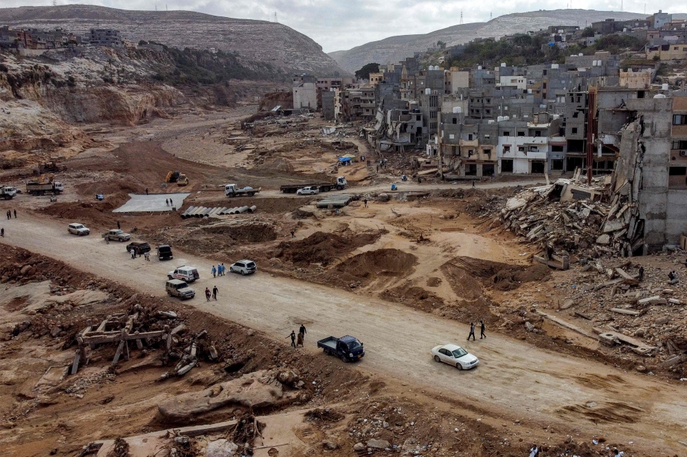 An aerial view shows Libya's eastern city of Derna on September 18, 2023, following deadly flash floods. (Photo by Mahmud TURKIA / AFP)
