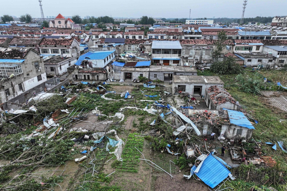 This aerial view shows damaged buildings after a tornado hit the city of Suqian, in China's eastern Jiangsu province on September 20, 2023. (Photo by AFP) / China OUT
