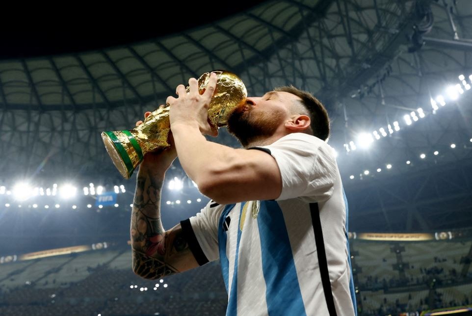 Argentina's Lionel Messi kisses the World Cup trophy as he celebrates after winning the FIFA World Cup Qatar 2022 tournament at the Lusail Stadium on December 18, 2022. (Reuters file photo)

