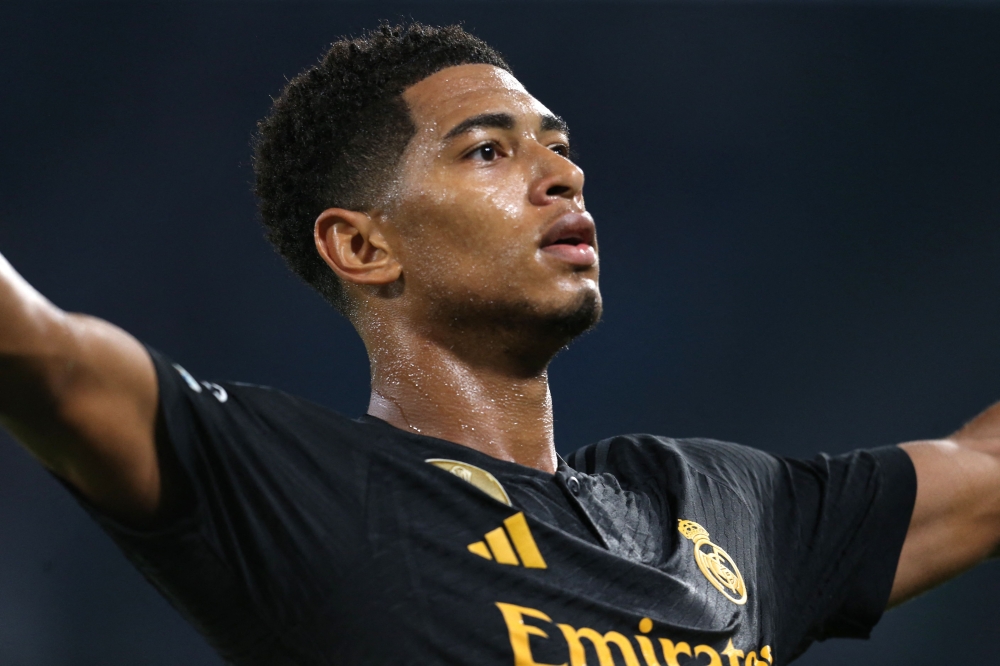 Real Madrid's English midfielder #5 Jude Bellingham celebrates scoring his team's second goal during the UEFA Champions League 1st round day 2 Group C football match on October 3, 2023. (Photo by Carlo Hermann / AFP)