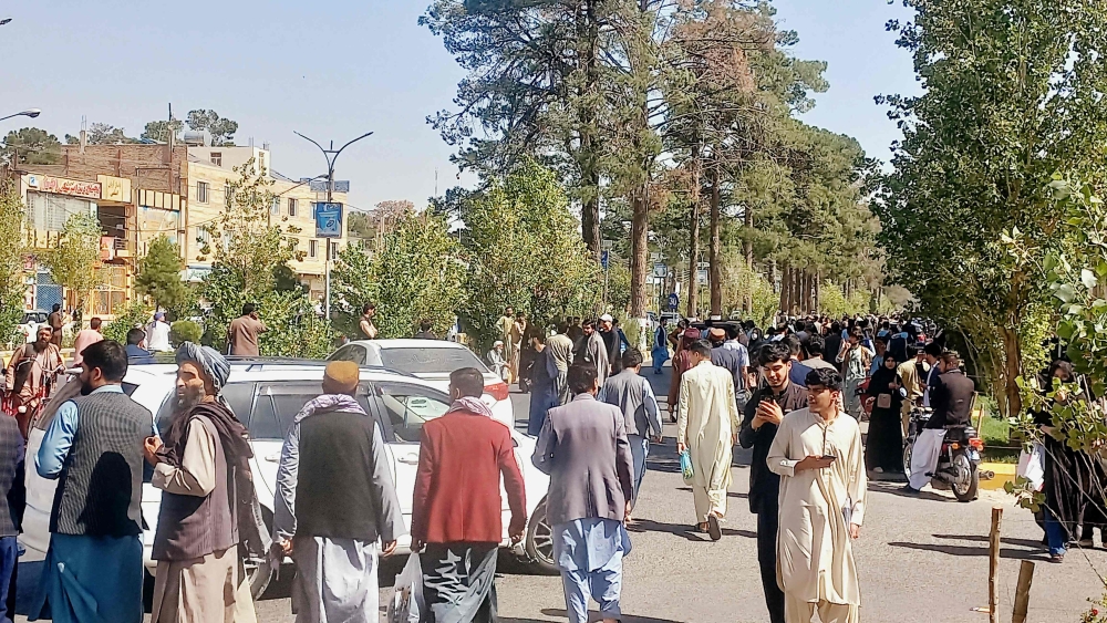People gather on the streets in Herat on October 7, 2023. (Photo by AFP)