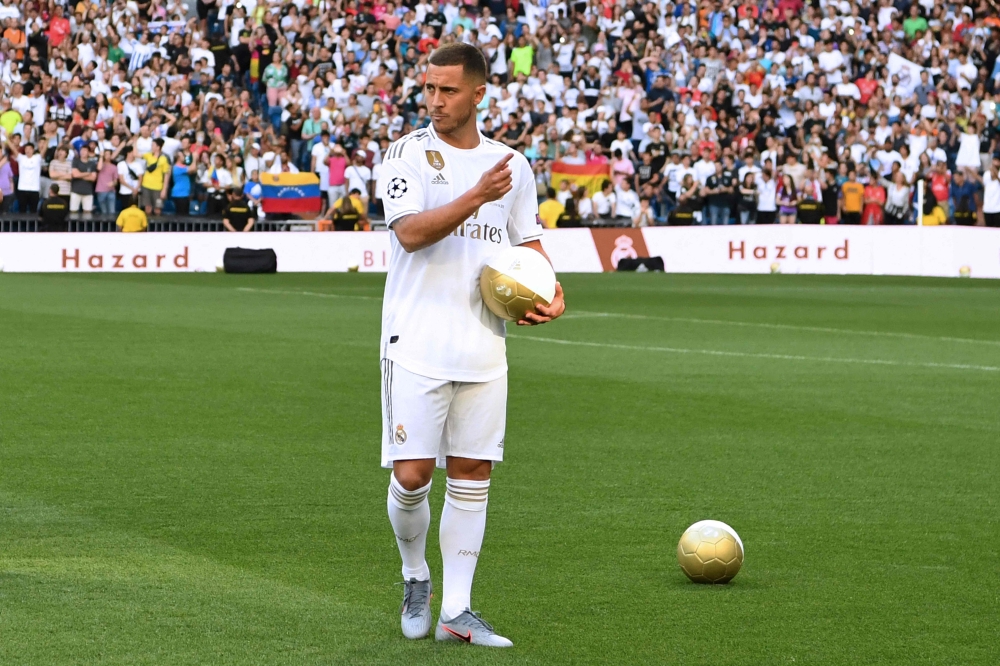 A picture taken on June 13, 2019, shows Belgian footballer Eden Hazard during his official presentation as new player of the Real Madrid at the Santiago Bernabeu stadium. (Photo by Gabriel Bouys / AFP)