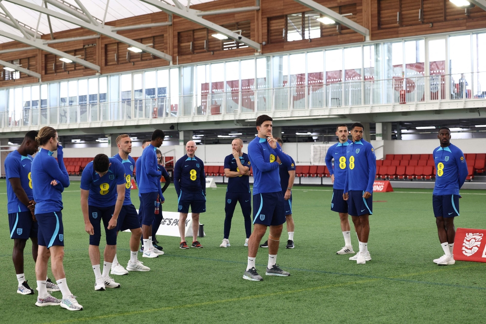 England's defender Harry Maguire (C) stands with teammates during an England football team training session at St George's Park in Burton-on-Trent, central England, on October 10, 2023. Photo by Darren Staples / POOL / AFP