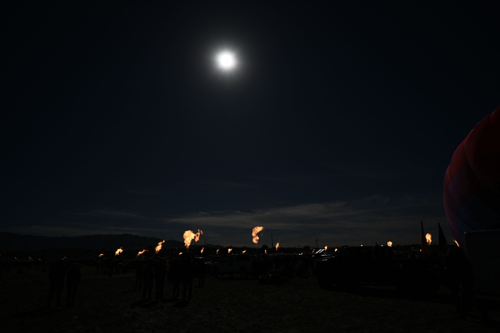 Hot air balloon operators create a 