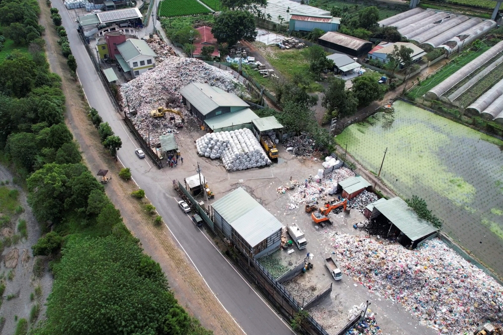 This aerial picture taken on October 19, 2023 shows garbage at the PULI Township Sanitation Department office building in Nantou County. (Photo by Sean Chang / AFP)