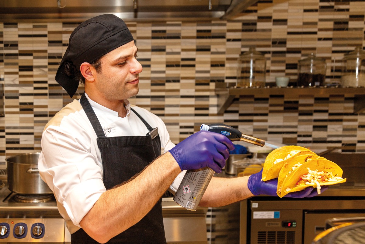 A chef in action at the Wyndham Grand Doha West Bay Beach.
