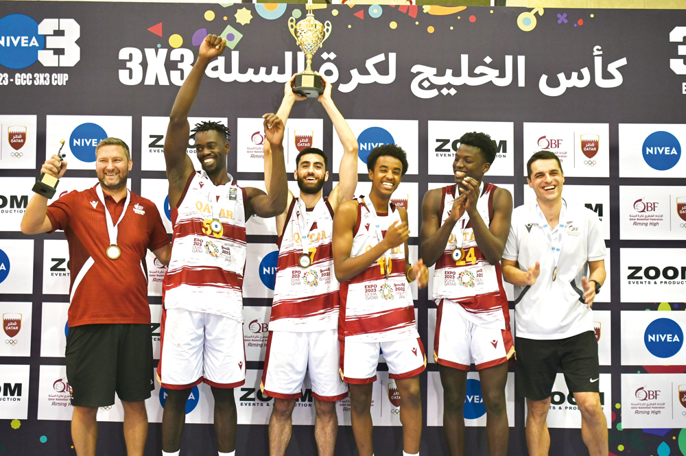 The players and officials of Qatar Team B celebrate after winning the GCC 3×3 Basketball Championship.