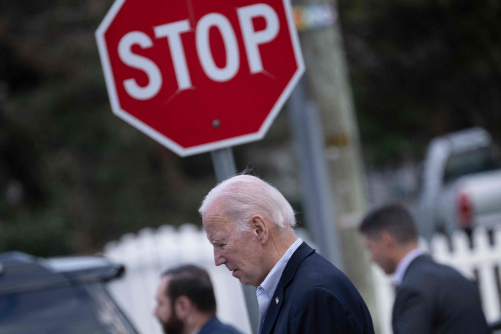 US President Joe Biden leaves Saint Edmond Catholic Church after attending mass on November 4, 2023 in Rehoboth Beach, Delaware. (Photo by Brendan Smialowski / AFP)
