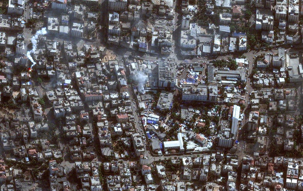This handout satellite picture released by Maxar Technologies on November 12, 2023, shows the damage arround the Shifa Hospital in Gaza City's al-Rimal district. (Photo by Satellite image 2023 Maxar Technologies / AFP) 