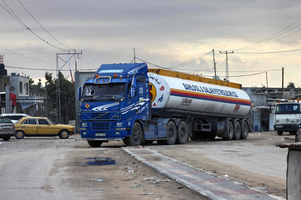An Egyptian fuel truck waits on the Egyptian side of the Rafah border crossing with the southern Gaza Strip, in the northeastern Sinai province on November 15, 2023. (Photo by AFP)