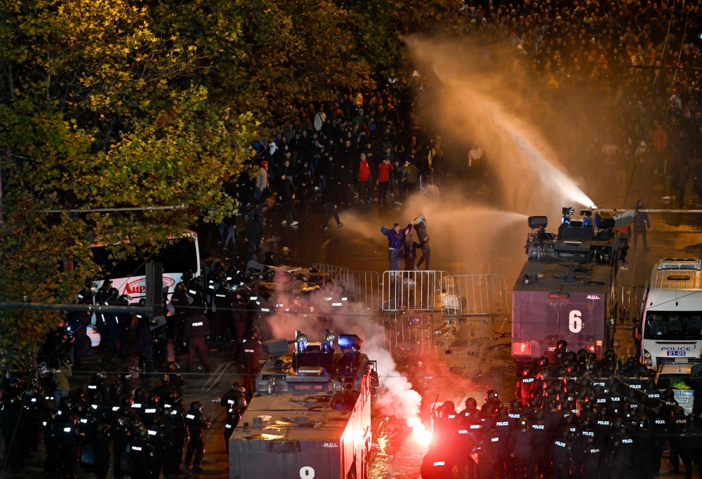 Police uses a water cannon towards protesters outside the Vassil Levski Stadium ahead of the UEFA Euro 2024 Group G qualification football match between Bulgaria and Hungary, at the Vassil Levski Stadium in Sofia, on November 16, 2023. Photo by Nikolay DOYCHINOV / AFP
