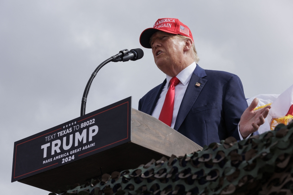 Former President Donald Trump gives remarks at the South Texas International airport on November 19, 2023 in Edinburg, Texas. Trump took the stage shortly after Texas Governor Greg Abbott officially endorsed the former president for his 2024 presidential campaign. (Photo by Michael Gonzalez / GETTY IMAGES NORTH AMERICA / Getty Images via AFP)