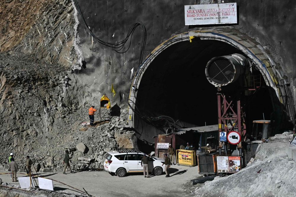A general view shows the entrance of the under construction Silkyara road tunnel during rescue efforts for trapped constructions workers days after a section of the tunnel collapsed in the Uttarkashi district of India's Uttarakhand state on November 22, 2023. Photo by Arun SANKAR / AFP