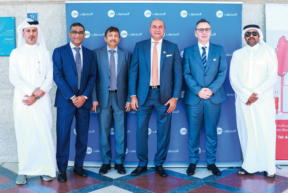 Officials pose for group photo during the blood donation drive.