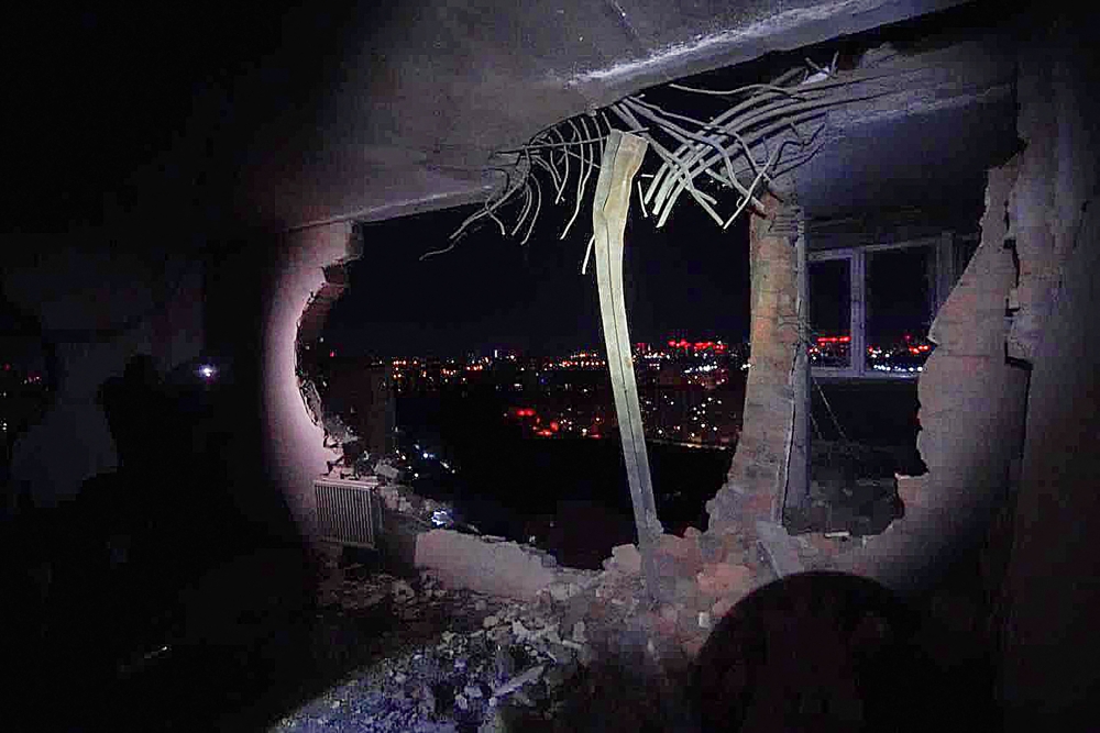 This handout photograph taken and released by Ukrainian Emergency Service on December 22, 2023, shows damages in a multi-storey residential building, after a Russian drone attack in Kyiv. (Photo by Handout / UKRAINIAN EMERGENCY SERVICE / AFP) 
