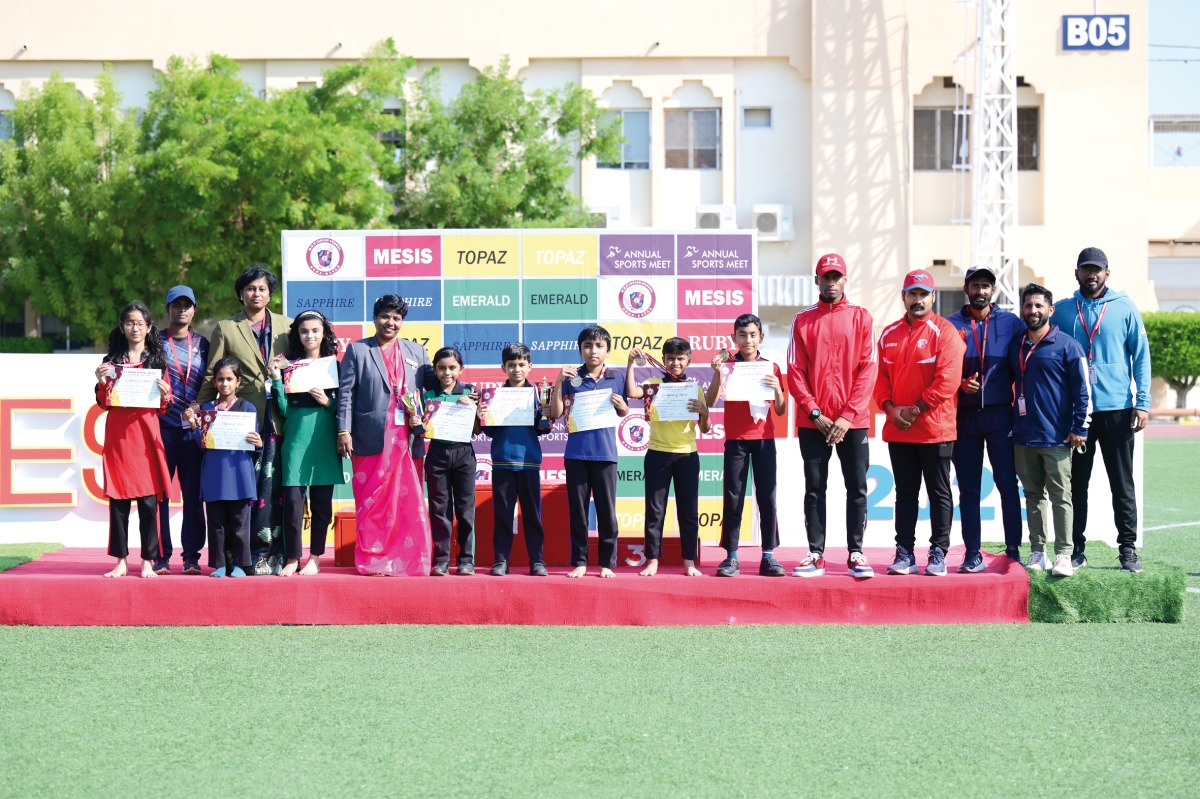 Winners on the podium with MESIS staff and guests at the event.