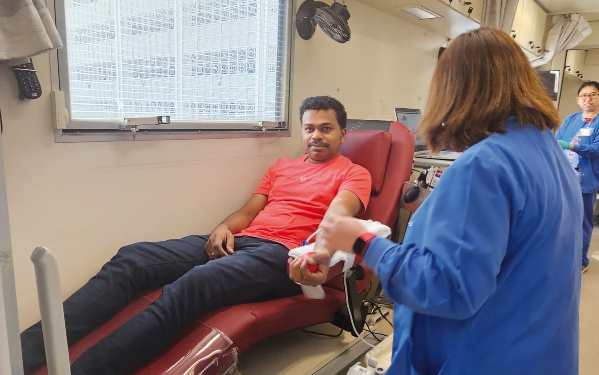A man donates blood during the campaign.