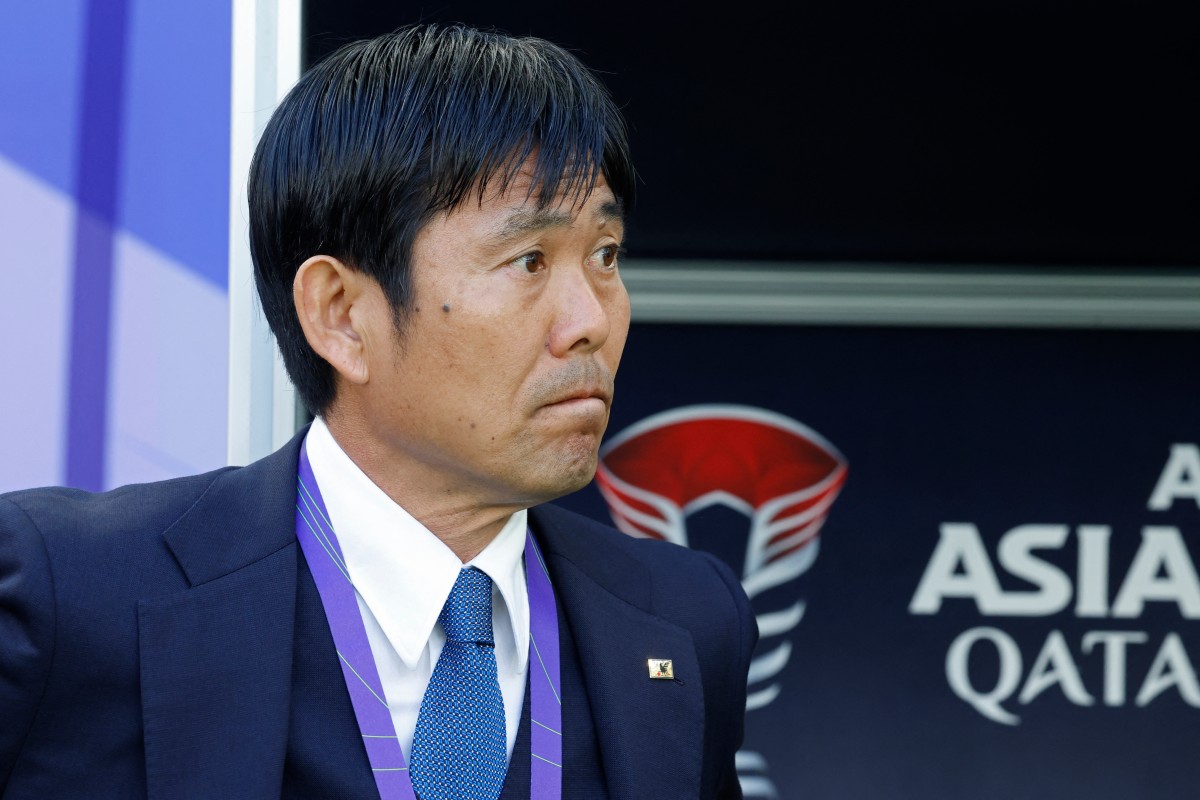 Japan's coach Hajime Moriyasu watches before the start of the Qatar 2023 AFC Asian Cup Group D football match between Japan and Vietnam at the Al-Thumama Stadium in Doha on January 14, 2024. (Photo by KARIM JAAFAR / AFP)