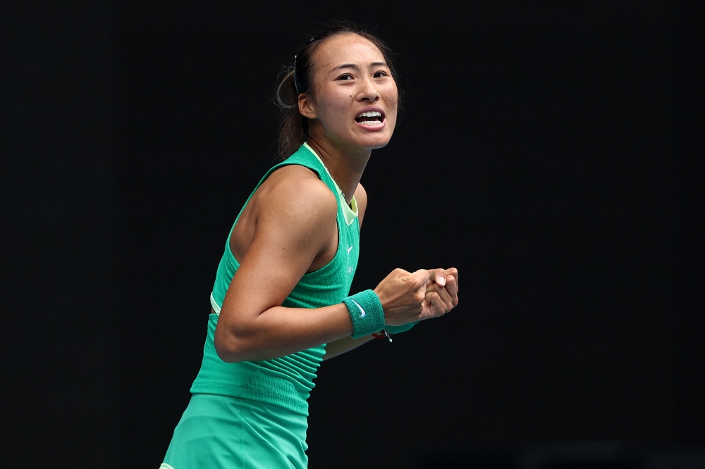 China's Zheng Qinwen celebrates victory against her compatriot Wang Yafan during their women's singles match on day seven of the Australian Open tennis tournament in Melbourne on January 20, 2024. (Photo by Martin Keep / AFP)
