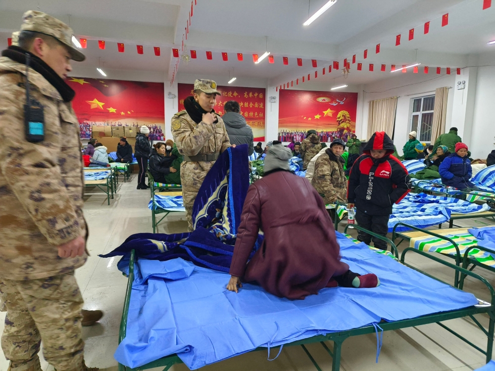 Local residents rest at a temporary shelter after a magnitude 7.1 earthquake strikes Wushi County, Aksu prefecture, in China痴 northwestern Xinjiang region on January 23, 2024. (Photo by CNS / AFP) / China Out