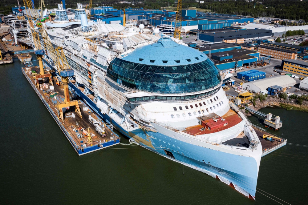 An aerial view taken on May 30, 2023 shows the construction site of the Royal Caribbean's new ship 'Icon of the Seas' at the Turku shipyard in Finland's southwest coast. Photos by Jonathan NACKSTRAND / AFP

