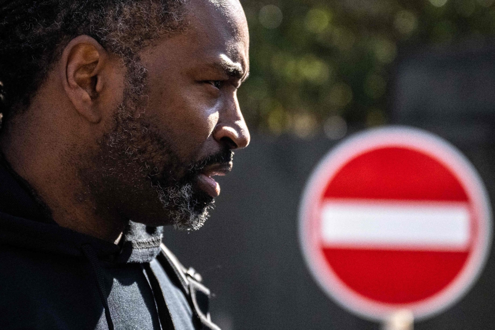 Maurice (first name only), a US citizen with Japanese permanent residency status, speaks to the media outside Tokyo district court in Tokyo on January 29, 2024. (Photo by Philip FONG / AFP)