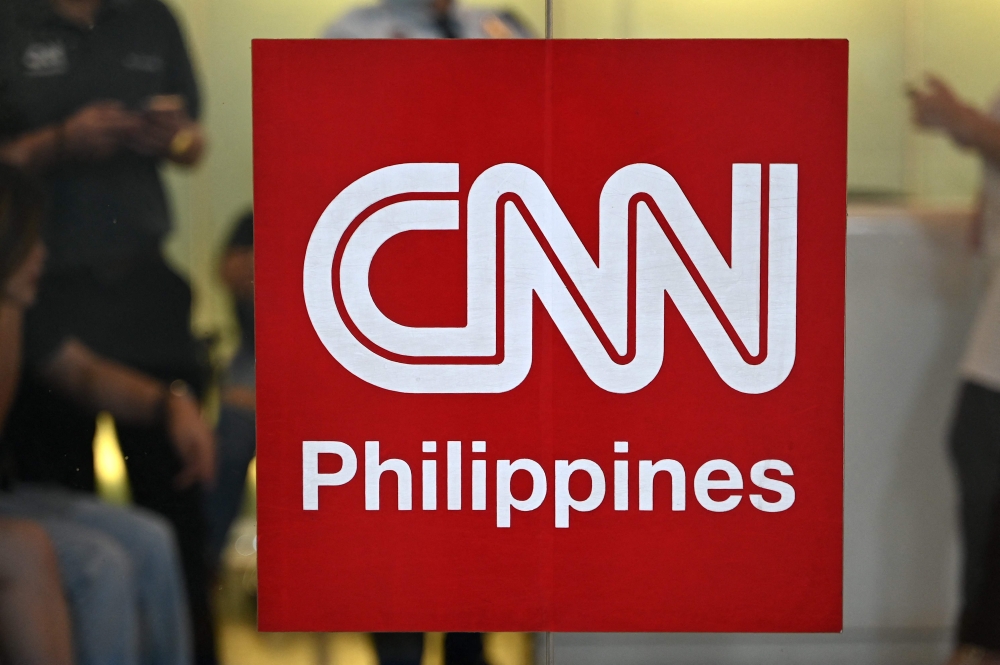 The logo of CNN Philippines is seen outside their office in Mandaluyong, Metro Manila on January 29, 2024. Photo by JAM STA ROSA / AFP