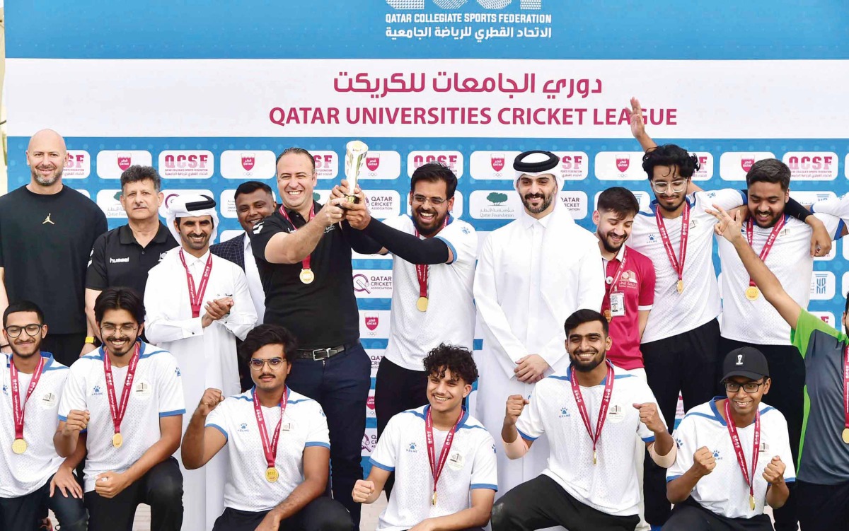 QU Cricket team with the trophy at the end of the final match of the Universities Cricket League.