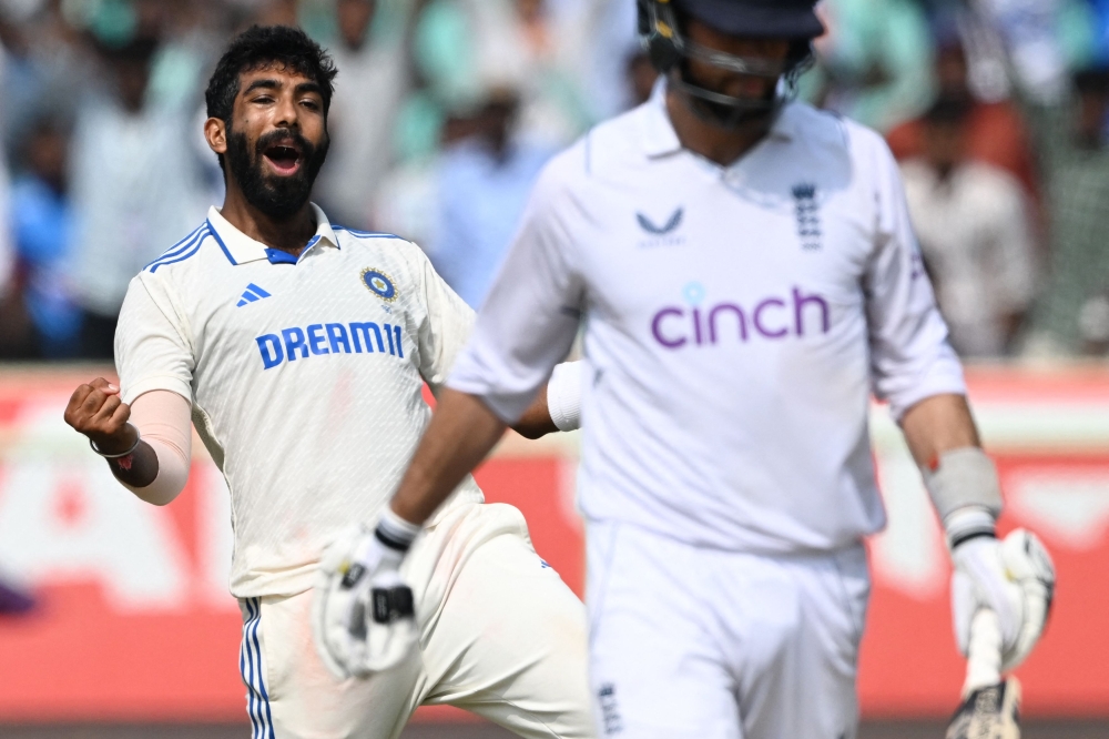 India's Jasprit Bumrah celebrates after taking wicket of England's Ben Foakes (R) at the YS Rajasekhara Reddy Cricket Stadium in Visakhapatnam on February 5, 2024. (Photo by Dibyangshu Sarkar / AFP) 