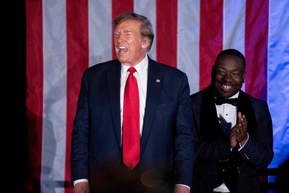 Former US President Donald Trump shouts to the crowd during the Black Conservative Federation Gala on February 23, 2024 in Columbia, South Carolina. Sean Rayford/Getty Images/AFP 