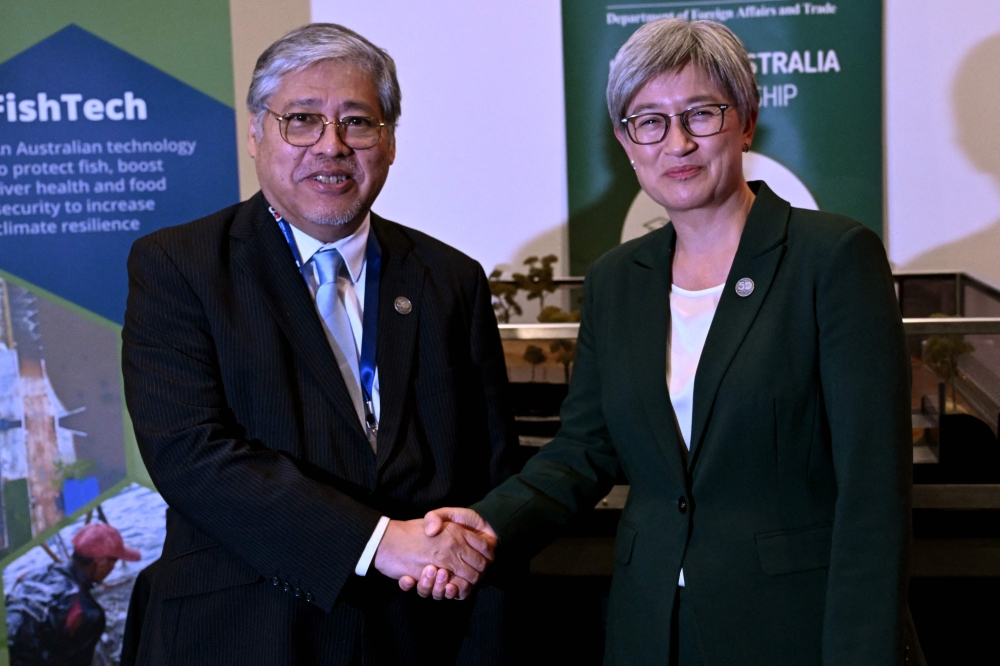 Philippines' Foreign Secretary Enrique Manalo (Left) and Australia's Foreign Minister Penny Wong before the opening of the Australia-ASEAN (Association of Southeast Asian Nations) Summit in Melbourne on March 4, 2024. (Photo by William West / AFP)