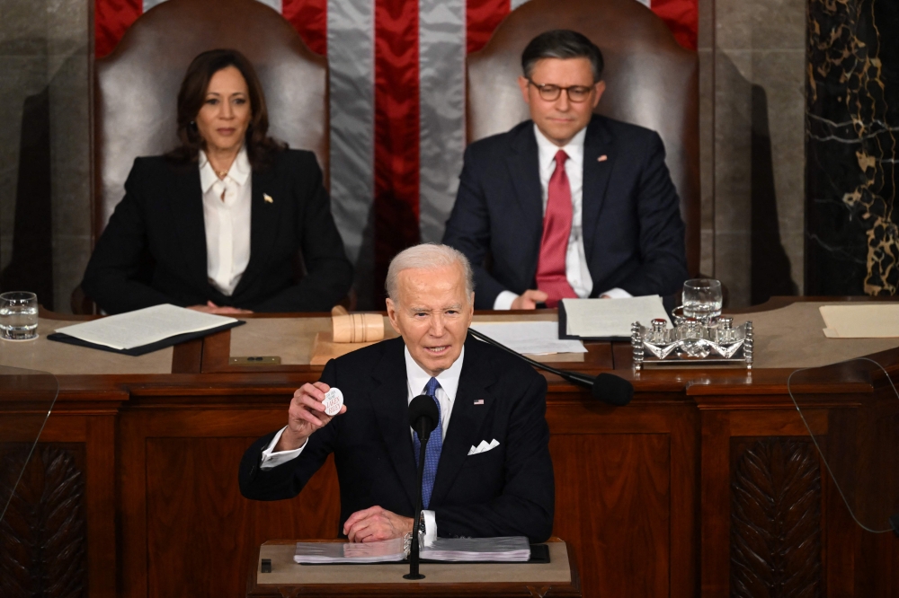 US President Joe Biden holds a 