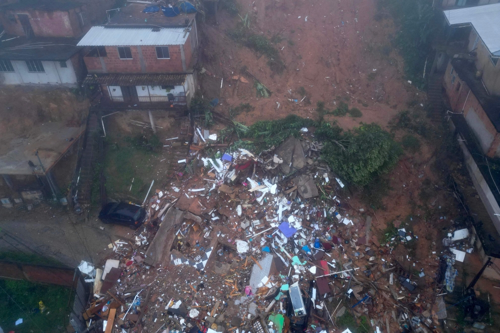 Aerial view showing rubble of houses destroyed due to heavy rains in Petropolis, Brazil, on March 23, 2024. (Photo by Florian PLAUCHEUR / AFP)
