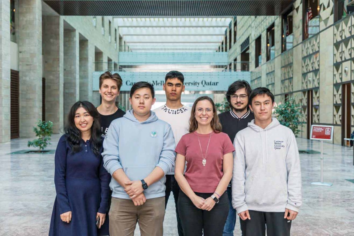The CMU-Q representatives and officials at the tournament.