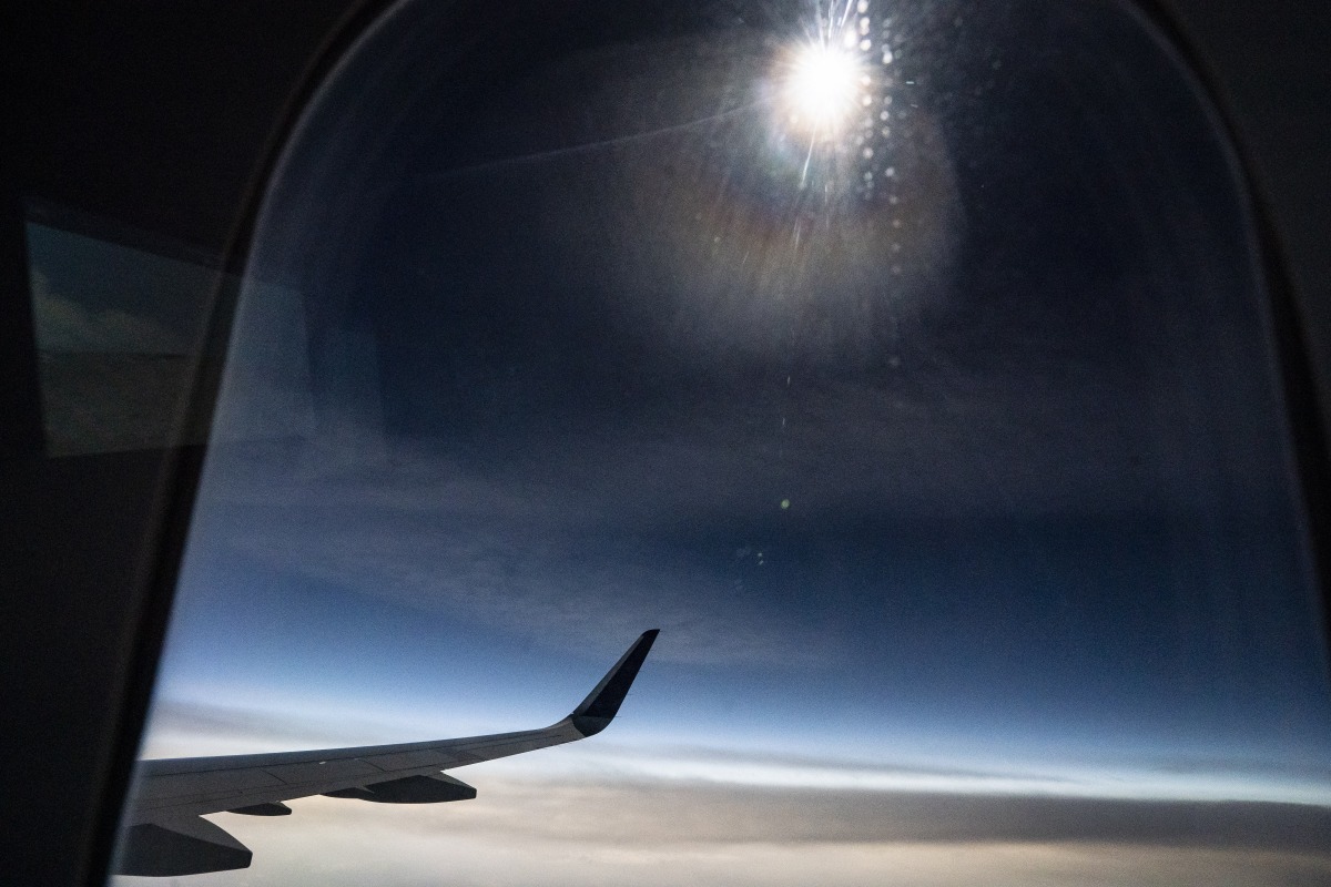 Dark skies can be seen out of the window of Delta flight 1010 on Monday. Pic: Jabin Botsford/The Washington Post