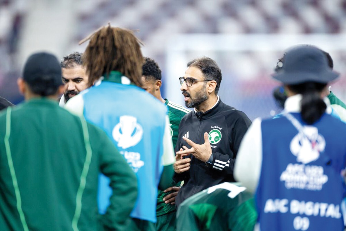 Saudi Arabia coach Saad Al Shehri speaks to his players. AFC  