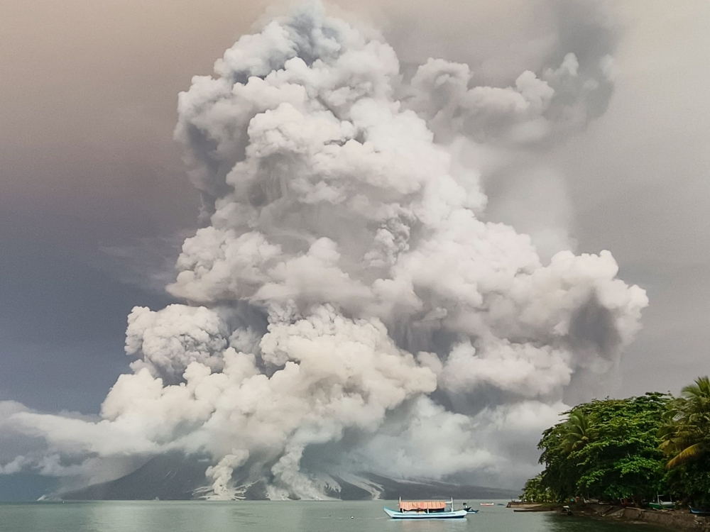An eruption from Mount Ruang volcano is seen from Tagulandang island in Sitaro, North Sulawesi, on April 30, 2024. (Photo by AFP)
