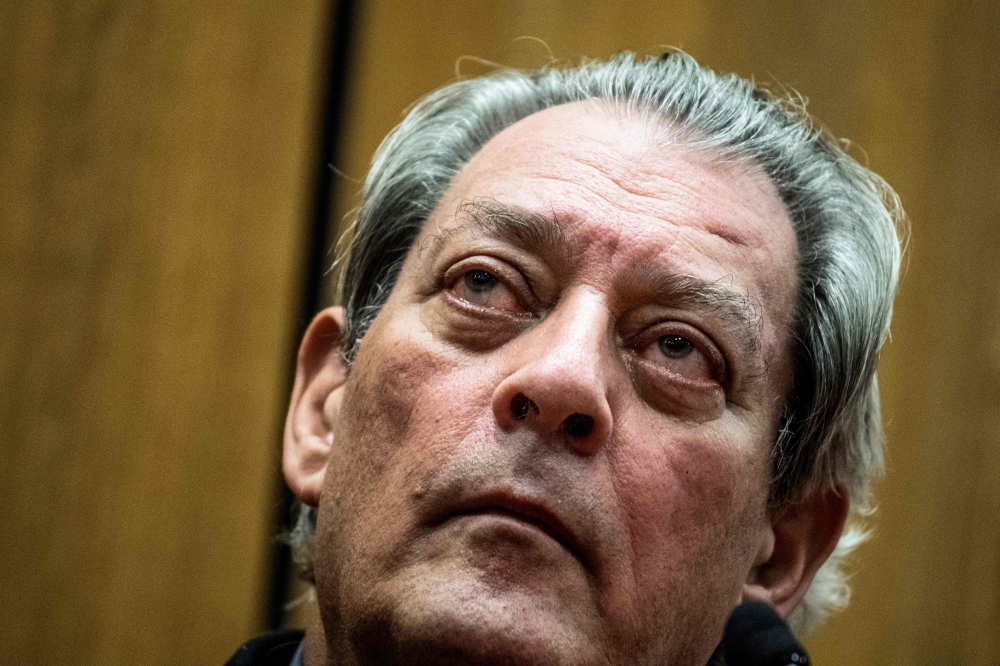 (FILES) US writer Paul Auster looks on in Lyon on January 16, 2018. (Photo by JEFF PACHOUD / AFP)
