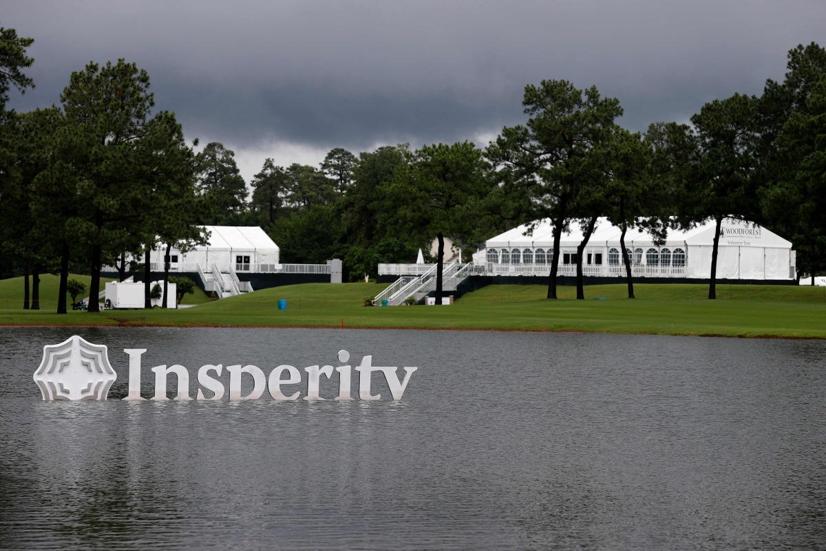 THE WOODLANDS, Texas - MAY 3: A general view of Insperity signage in the water on the 18th hole during the first round of the Insperity Invitational at The Woodlands Golf Club on May 3, 2024 in The Woodlands, Texas. Aaron M. Sprecher/Getty Images/AFP (Photo by Aaron M. Sprecher / GETTY IMAGES NORTH AMERICA / Getty Images via AFP)