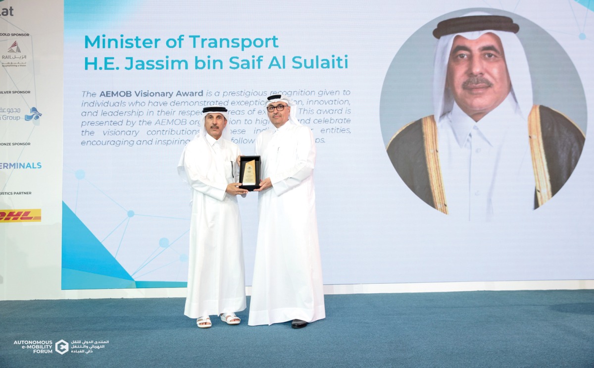 AEMOB official awarding a recipient during the ceremony.