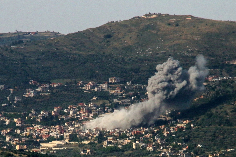 Smoke billows over the southern Lebanese village of Kfar Kila following Israeli bombardment on May 10, 2024. (Photo by Rabih DAHER / AFP)