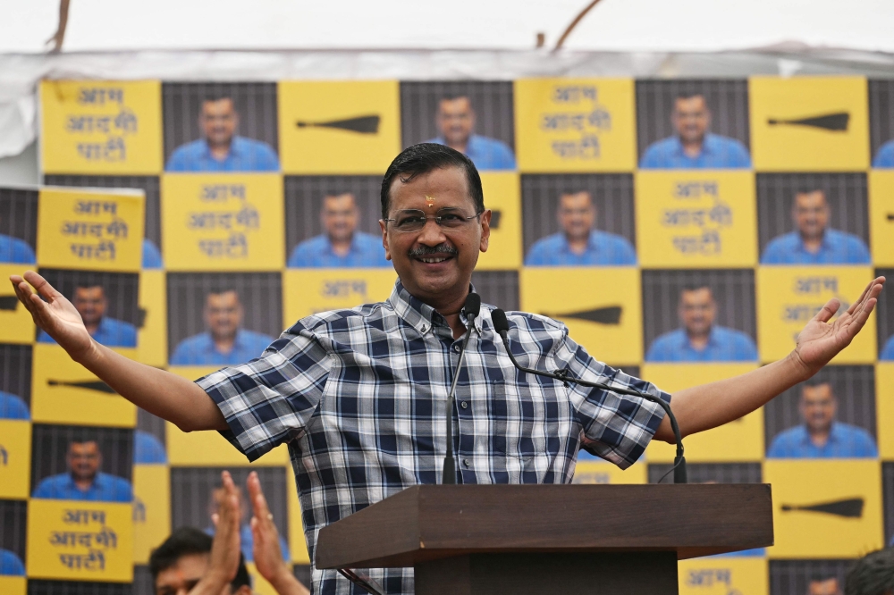Aam Aadmi Party (AAP) leader and chief minister of Delhi Arvind Kejriwal gestures as he speaks during a press conference at the party headquarters in New Delhi on May 11, 2024. (Photo by Arun Sankar / AFP)